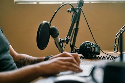 Creator recording at a StudioYT podcast desk setup