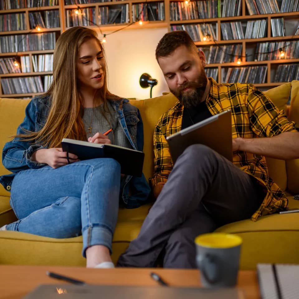Young creators relaxing and planning on a couch